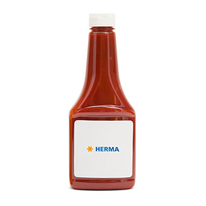 Bottle with red liquid, labeled with 'HERMA' on a white label.