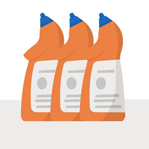 Three bottles with orange caps, containing cleaning agents, are lined up next to each other on a white surface.