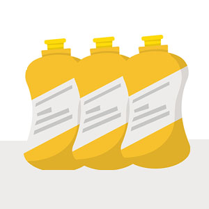 Three yellow bottles with white labels that may contain a liquid.