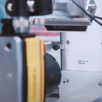 A machine with a yellow component and a date stamp showing June 22, 2020, is in focus.