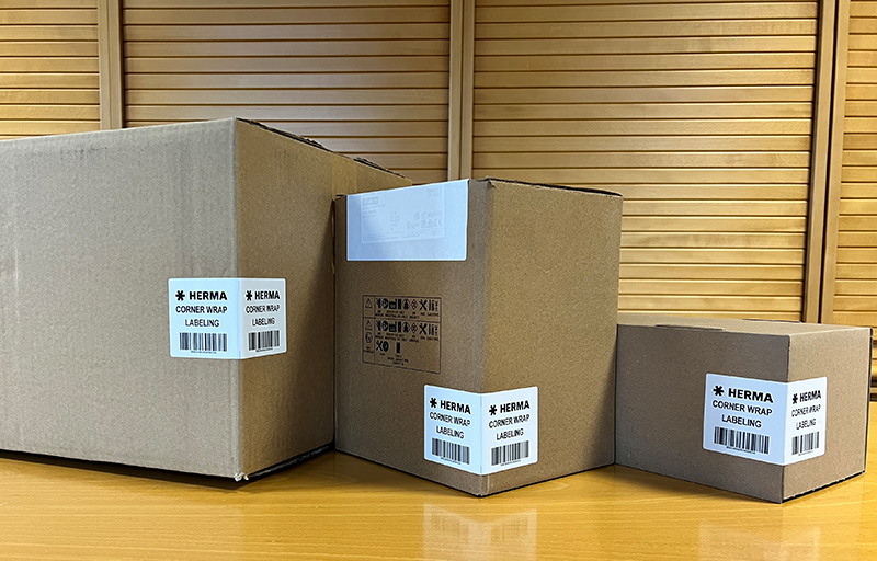 Three boxes in different sizes with labels containing information about the contents and shipping details.