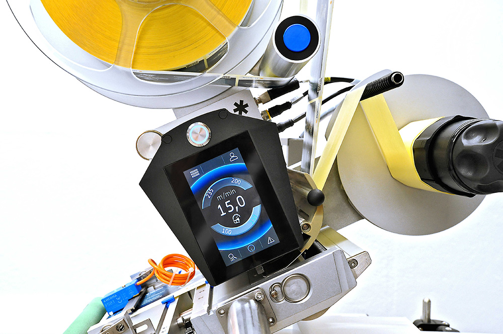 A modern device with a digital touchscreen used for controlling machines or processes. It displays a speed of 150 minutes.