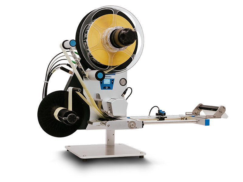 A labeling machine with a large roll holder, a dispenser, and a control panel to manage the labeling process.