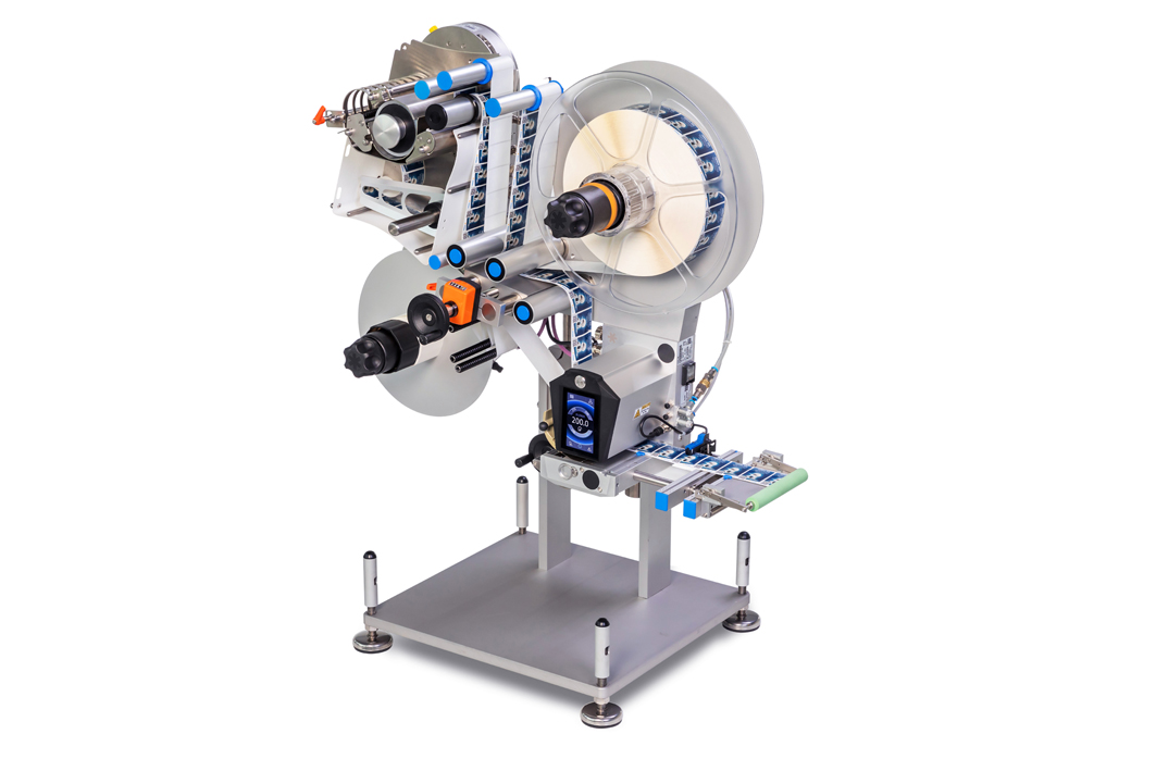 A labeling machine with multiple rollers and a sturdy base, designed for the automated labeling of products.