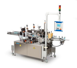 An automated labeling machine with multiple stations, a control unit, and safety indicators.