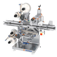 Automatic labeling machine with multiple label dispensers, equipped with control elements and a sturdy frame.