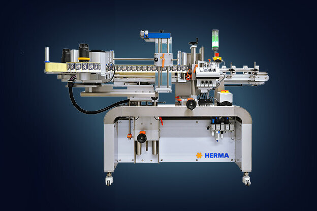 An industrial machine with various components for automation, set on a sturdy frame, against an abstract blue background.