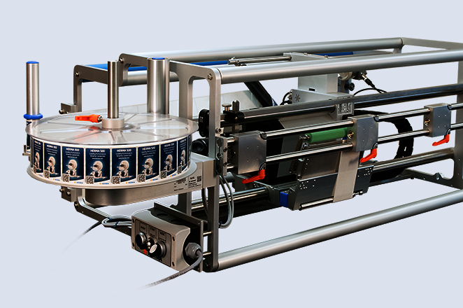 An industrial machine with a circular conveyor system and a motor, designed for automated production processes.